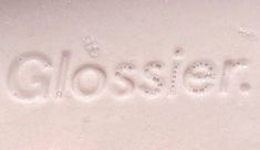 the word glosser is written in water droplets