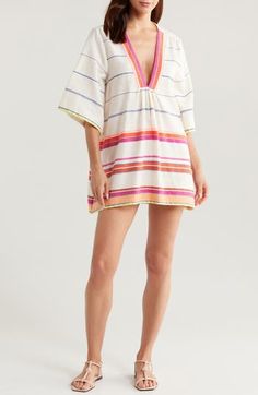 Hand spun and woven in Ethiopia, this colorful cover-up will be your constant companion at the beach or pool. 33" length (size medium) Deep V-neck Elbow-length sleeves 95% cotton, 5% acrylic Dry clean Made in Ethiopia Black Owned/Founded Striped Beach Dress For Vacation, Woven Summer Beach Dress, Woven Beach Dress For Summer, Woven Beach Dresses For Summer, Summer Striped Beach Dress, Striped Beach Dress For Beach Season, Multicolor Beach Dress For Resort Season, Striped Beachwear Dresses For Beach, Striped Beachwear Dresses For Vacation