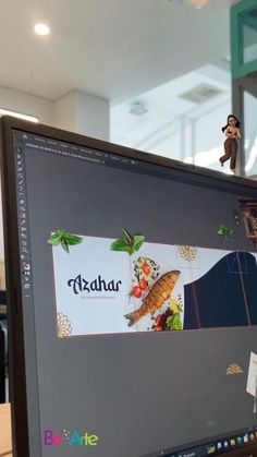 a computer monitor sitting on top of a desk