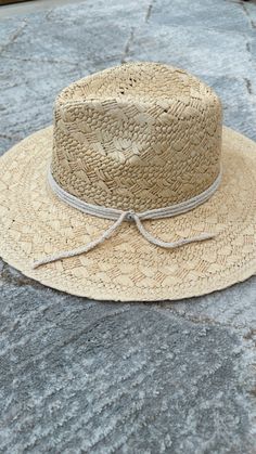 Take to the beach in style with our Life's a Breeze Straw Hat! Woven straw shapes this sunny day essential hat. Cotton cord band is accented with Swarovski crystals. Featuring a molded crown with a pinched 10cm brim and hand woven straw. -Rancher style hat with a chill & casual vibe-Brim is flexible but holds its shape-Pinched top-Great quality-- will last forever-A fabulous hat for spring/summer - 4" brim - Adjustable inner drawstring for custom sizing Adjustable Sun Fedora For The Beach, Adjustable Summer Fedora In Toquilla Straw, Adjustable Fedora For Beach, Summer Fedora With Braided Flat Brim, Summer Braided Toquilla Straw Fedora, Woven Toquilla Straw Hat Bands For Beach, Adjustable Toquilla Straw Fedora For Beach, Braided Straw Hat For Vacation, Summer Straw Fedora With Braided Detail