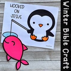 a paper cut out of a penguin holding a fishing rod with the words hooked on jesus