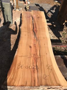 a large piece of wood with writing on it