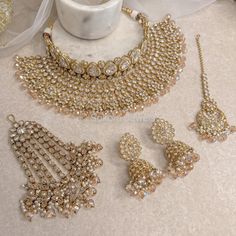 Antique Gold polished small choker and large necklace set made up of of clear zircon crystals , light Golden crystal beads with off white pearl drops Comes complete with matching tikka:  2 inch pendant with 4 inch chain, and jhumka earrings measuring 2.5 inch in length. Jhumar is optional  This set is ready to ship as seen with gift box. Bridal Jewelry Sets Brides, Golden Crystal, Double Necklace, Fancy Jewellery Designs, Bridal Necklace Set, Large Necklace, Indian Jewelry Sets, Bridal Bangles, Bangles Jewelry Designs