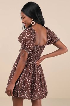 You'll be the first thing on your sweetie's mind in the Lulus Delightful Crush Brown Floral Smocked Puff Sleeve Mini Dress! Lightweight woven fabric, with a burnout design and ditsy floral print throughout, shapes short puff sleeves with elastic cuffs and bow details. Ruffle-trimmed square neckline tops a smocked bodice with a fitted waist. Flaring skirt finishes at a bubble-style mini hem. Fit: This garment fits true to size. Length: Mid-thigh. Size medium measures 26.5" from shoulder to hem. B Smocked Mini Dress, Bubble Style, Dress With Puff Sleeves, Tier Dress, Puff Sleeve Mini Dress, Tiered Ruffle Dress, Be First, Ditsy Floral Print, Puff Sleeve Dresses