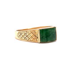 This one of a kind Mid-Century jade ring features a diamond and dot geometric engraved pattern in 14 karat yellow gold. The natural green jade reflects forest green hues. Set in channel bars. A vintage statement ring to admire. The cabochon cut gem is accented by engraved shoulders on a tapered 14K yellow gold band. The ring measures 6mm wide. A stunning gift for you or your loved one. The iconic birthstone of March. Antique Emerald Ring In Stamped 14k Yellow Gold, Antique Green Rings With Polished Finish, Vintage Wide Band Yellow Gold Jewelry, Green 14k Stamped Signet Ring, Heirloom 14k Gold Emerald Ring Collectible, Antique Green Emerald Ring In 14k Gold, Collectible Green Emerald Ring In 14k Gold, Antique 14k Gold Green Emerald Ring, Vintage Yellow Gold Hallmarked Emerald Ring