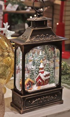 a christmas lantern sitting on top of a table