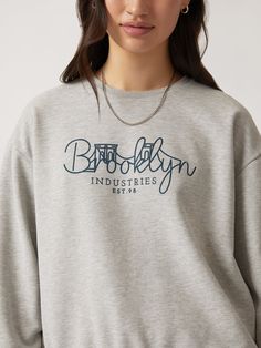 Our Brooklyn Bridge crewneck features an illustrated graphic across the chest. Its relaxed fit and dropped shoulders make it an easy layer, while the brushed fleece backing is soft enough to wear alone. #B1S10137-80018 Fabric: 100% cotton Casual Boxy Crew Neck Sweatshirt, Cotton Graphic Print Sweats For Loungewear, Trendy Gray Sweatshirt With Graphic Print, Graphic Print Crew Neck Sweatshirt For Loungewear, Trendy Boxy Fit Crew Neck Sweatshirt, Graphic Print Crew Neck Sweater For Loungewear, Casual Sweats With Graphic Print And Relaxed Fit, Casual Graphic Print Sweats With Relaxed Fit, Loungewear Graphic Print Crew Neck Sweater