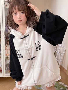 This jacket is crafted from pure cotton fabric, featuring an original design with unique prints and contrasting traditional Chinese frog button closures. Its loose fit is both flattering and stylish. The jacket also comes with convenient pockets on both sides, adding practicality to its charm. To top it off, the hood is adorned with soft and adorable bear ears, making it irresistibly cute when worn.  The price includes one jacket only.   	 		 			Size 			Free Size 		 		 			Bust 			140 		 		 			Le Black Harajuku Style Cotton Outerwear, Black Cotton Harajuku Outerwear, Harajuku Style Cotton Outerwear With Pockets, Harajuku Style Cotton Outerwear With Drawstring Hood, Cotton Hoodie With Patchwork, Cotton Hoodie With Buttons For Fall, Casual Cotton Hoodie With Button Closure, Harajuku Style Cotton Hoodie Outerwear, Cotton Hoodie With Buttons