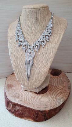 "Bridgerton Inspired Jewelry Rox. Victorian Regency Style White Crystal Rhinestone Sparkling Dangling Collar Necklace. Regal Necklace Gorgeous Vintage in wonderful condition, White Crystal Rhinestone Sparkling Dangling Collar Necklace. Just Grand! This is a lovely vintage piece! Necklace can be worn up to 20 inches with extender Almost a 4 inch drop with center dangle. Divine! Glam it up Bridgerton Style;) *If you have have any questions regarding this item, please hit the \"Ask a Question\" but Glamorous Rhinestone Necklace For Wedding, Glamorous Rhinestone Wedding Necklace, Silver Rhinestone Wedding Necklace, Glamorous Rhinestone Necklace As Gift, Glamorous Rhinestone Necklace For Gift, Crystal Bridal Necklace With Rhinestones As Gift, Crystal Costume Jewelry Necklace For Anniversary, Costume Jewelry Crystal Necklaces With Rhinestones For Wedding, Anniversary Costume Jewelry Rhinestone Necklace