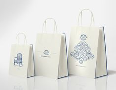 three bags with designs on them sitting next to each other in front of a white background