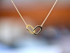 This gorgeous necklace can stand on it's own. Great for wearing everyday, to work or to play. The interlocking oval symbolize the bonds of relationships. This is a gift you can't go wrong with. Metal : 14k Gold Chain Length : 18 inches Pendant Size : 23x8mm See other items from my store here https://www.etsy.com/shop/GalantaJewels?ref=hdr_shop_menu Packaging : All products purchased from us come in a gift box. If you need to include a message, kindly leave us a note when purchasing. Care Recomme Oval Link Necklaces With Polished Finish For Weddings, Polished Oval Link Necklaces For Weddings, Oval Link Necklace With Polished Finish As Gift, Oval Link Hallmarked Necklace For Wedding, Heart-shaped Yellow Gold Necklace With Box Chain, Adjustable 14k Gold-filled Heart Necklace, 14k Yellow Gold-filled Heart Necklace For Valentine's Day, Heart-shaped Yellow Gold Brass Necklace, Gold-tone Heart Pendant Necklace For Valentine's Day