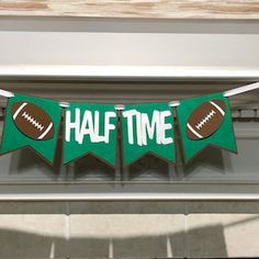 a football themed banner that says half time