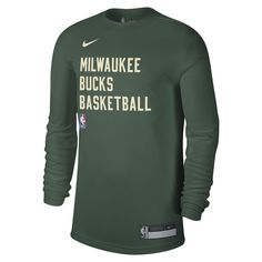 Represent your Milwaukee Bucks with the unisex Nike hunter green Milwaukee Bucks 2023/24 Legend on-court practice long sleeve T-shirt. This official team apparel features screen print graphics and a heat sealed jock tag, showcasing your unwavering support for the Bucks. Made with at least fifty-five percent recycled content, this sustainable T-shirt aligns with Nike's Move To Zero initiative, demonstrating your commitment to both the team and the environment. Heat sealed jock tag Crew neck Long Collegiate Green Top With Team Logo, Collegiate Green Tops With Team Logo, Green Crew Neck Top With Team Logo, Moisture-wicking Green Top For Team Events, Green Moisture-wicking Top For Team Events, Sportswear Top With Team Logo For Streetwear, Nike Green T-shirt For Streetwear, Sportswear Tops With Team Logo, Green Logo Print Athleisure T-shirt