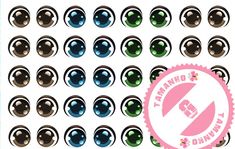 an assortment of different colored eyeballs on a white background