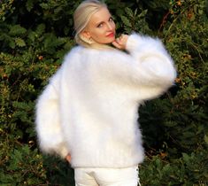 "FUZZY HAND KNITTED MOHAIR SWEATER by SuperTanya Hand knitted with love and care for your comfort and complete satisfaction. Its clear and plain design makes this warm and breathable fashion cloth suitable for any occasion. Wherever you are, the lovely white color will make you feel like a star. At office, shopping center or at home - you will be the \"only one\", around. With the crew neckline style you will fully comply with the fashion trends for the upcoming season. This premium quality, han Elegant Oversized White Sweater, Cozy Soft Knit White Sweater, White Cozy Soft Knit Sweater, Cozy White Soft Knit Sweater, Oversized White Soft Sweater, White Knitted Crew Neck Sweater, White Soft Knit Winter Sweater, White Soft Knit Cozy Fit Sweater, White Soft Knit Sweater With Cozy Fit