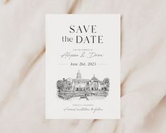 an image of save the date card on top of a bed with white linens