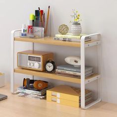 a shelf with various items on top of it and a cell phone next to it