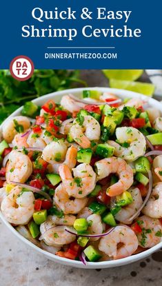 a bowl filled with shrimp and veggies next to some cilantro sauce