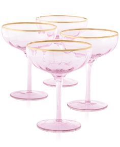 four pink wine glasses with gold rims