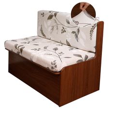 a wooden bed frame with a white floral print sheet on it's headboard