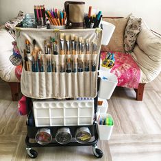 a cart filled with lots of art supplies