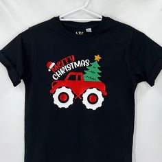 Boy Christmas Truck Tee  Kids Unisex printed T-Shirts, Every tee is made to order. To ensure longevity of your shirt, Wash inside out and please don't iron directly on the print, iron inside out or a great tip is to hang straight on a coat hanger and hang to dry inside. SIZING: The Kids Youth t-shirts are made with 100% premium combed cotton and are a unisex t-shirt. Make sure to take a peak at the size chart to get a good description of the size so we can get the best fit for the kids. These measurements are half chest measurements, so keep that in mind when looking at the chart. Kids Youth T-Shirts are ordered as per the item is bought, so a longer delivery time may occur. I will endeavour to have them out to you within 7 to 10 days of your purchase date. Of course if I receive them earl Boys Christmas Shirt, Shirt For Boys, Women Motivation, Christmas Truck, Printed T Shirts, Boys Christmas, Coat Hanger, Kids Tops, Christmas Shirt