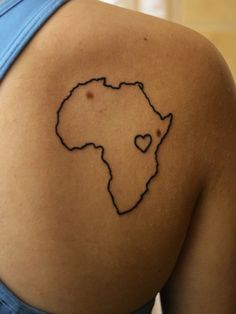 a woman's back with a heart shaped outline on it