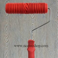 an image of a red paint roller being used to paint wood paneling with the ebay logo on it