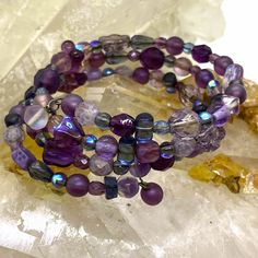 Purples, Pinks And Violets: Spring Wrap Bracelet - Some Iridescent Beads, Others Opaque. Spring Coil Is Tight Not Lax. Never Worn. Hand Wrapped Purple Bracelets, Adjustable Purple Bracelets For Party, Bohemian Purple Bracelets For Party, Bohemian Purple Bracelet For Party, Purple Round Bead Crystal Bracelet For Parties, Purple Round Beaded Crystal Bracelet For Parties, Purple Round Beads Crystal Bracelet For Party, Purple Crystal Round Beads Bracelet For Party, Lavender Beaded Bohemian Crystal Bracelet