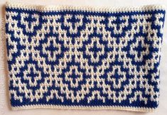 a blue and white crocheted dishcloth