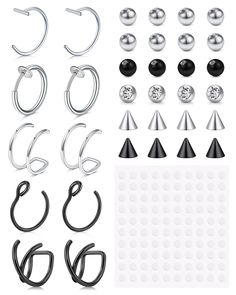 several pairs of earrings and piercings are shown in various shapes, sizes and colors