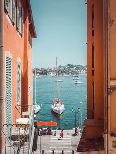 an alley way with boats in the water