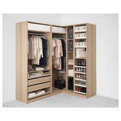 an open closet with clothes and handbags in it