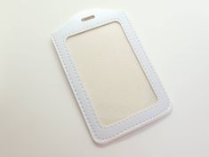 Clean and professional all white card carrier. Fits typical: Student photo ID card Drivers license Credit card Key card Teacher name badge Can hold 2-3 cards. 4.5 inches tall by 3 inches wide. Easy to care for. Great quality stitched PU leather. Simply wipe clean. Has one viewing window and a non see through back. Clip it to a lanyard: https://www.etsy.com/shop/Keytopia?ref=seller-platform-mcnav&section_id=27737100 More colors and styles here: https://www.etsy.com/shop/Keytopia?ref=seller-platfo White Rectangular Card Holder With Card Slots, White Rectangular Card Holder With Slots, White Rectangular Card Holder, Rectangular Badge Holder With Id Window As Gift, Rectangular Badge Holder With Id Window, White Rectangular Badge Holders For Everyday Use, White Rectangular Card Holder For Gift, White Rectangular Card Holder Gift, White Rectangular Badge Holder For Personal Use