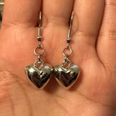 Cute Small Heart Shaped Silver Tone Hook Pierced Earrings *Brand New. *Silver Tone. *Material: Zinc Alloy. *Stainless Steel Hooks. *Size: 1.5 Inches Approximately. *Style: Coquette, Romantic, Glam, Retro. *Occasion: Casual, Going Out, Party, School, Work, Summer, Vacation, Outdoors, Etc. #Earrings #Heart #Silvertone #Gift#Valentines-Day Silver Heart Beads Earrings For Anniversary, Silver Dangle Heart Earrings For Party, Metal Heart Beads Earrings For Gifts, Metal Heart Beaded Earrings For Gifts, Heart Beads Metal Earrings For Gift, Gift Metal Heart Earrings With Heart Beads, Silver Metal Heart Earrings For Anniversary, Silver Heart Drop Earrings For Valentine's Day, Valentine's Day Silver Heart Drop Earrings