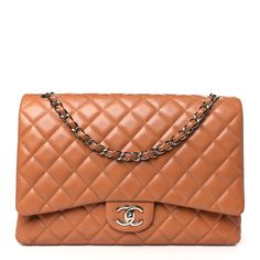 This is an authentic CHANEL Caviar Quilted Maxi Double Flap in Light Brown. This classic shoulder flap bag is crafted of luxurious diamond quilted caviar leather in a caramel brown. The shoulder bag features a polished silver chain link leather threaded shoulder straps and a semi-full front flap with a silver CC turn lock. This handbag opens to a matching matte leather interior with zipper and patch pockets. Chanel Double Flap, Chanel Crossbody, Coco Handle, Quilted Top, Chanel Flap Bag, Chanel Shoulder Bag, Heart Bag, Leather Thread, Chanel Caviar