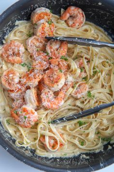 pasta with shrimp and parmesan cheese in a skillet, ready to be eaten