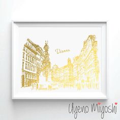 a yellow and white photo with the word vienna in gold foil on it's side