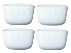 four white colanders sitting side by side