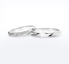 two white gold wedding bands with diamonds