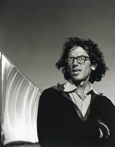 black and white photograph of a man wearing glasses