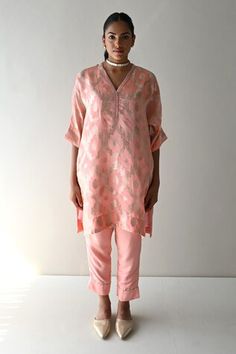 Rose pink straight kaftan style tunic with all over floral brocade pattern and side pockets. Paired with a cigarette pant. - Aza Fashions Festive Pink Straight Kurta Blouse, Festive Pink Set With Set-in Sleeves, Pink Straight Kurta Kaftan For Festive Occasions, Festive Pink Straight Kurta Kaftan, Elegant Pink Kaftan For Diwali, Pink Tunic Kurta For Festive Occasions, Pink Tunic For Eid, Festive Pink V-neck Kurta, Pink V-neck Diwali Kurta