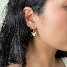 Dainty mini hoop earrings featuring a colorful butterfly charm ❀❀ INFO: ❀❀ ➳ Lever Back Hoop Style ➳ Hoop is 304 Stainless Steel ➳ Hoop size: 14.5 x 12.5 x 2mm ➳ Butterfly charm: 10mm ➳ Multiple colors to choose from ❀❀ AVAILABLE AS A SET WITH MATCHING NECKLACE: ❀❀ https://www.etsy.com/listing/904153141/mini-butterfly-earrings-and-necklace-set?ref=shop_home_active_12&frs=1 ❀❀ VIEW MORE EARRINGS: ❀❀ https://www.etsy.com/shop/bitsnpiecess/?section_id=23539584 ❀❀ SHIPPING & PROCESSING: ❀❀ P Trendy Hoop Earrings With Butterfly Charm As Gift, Butterfly Charm Huggie Earrings As Gift, Butterfly Charm Hoop Earrings As Gift, Trendy Butterfly Hoop Earrings As Gift, Dainty Hoop Earrings With Butterfly Charm, Hoop Earrings With Butterfly Charm For Gift, Butterfly-shaped Hypoallergenic Hoop Earrings For Gifts, Hypoallergenic Butterfly Hoop Earrings Gift, Single Butterfly