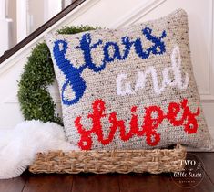 a pillow that says stars and stripes on it next to a basket with a stuffed animal