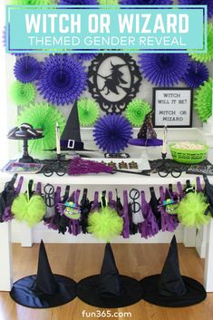 witch or wizard themed birthday party with purple, green and black decorations on the table