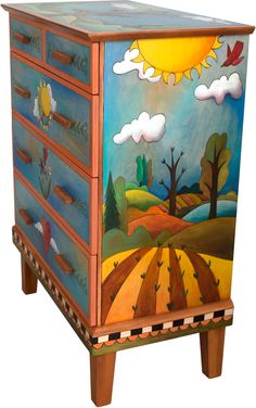 an artistic painted dresser on wooden legs