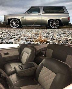 the interior of a silver truck parked on gravel