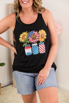 USA Sunflower Tank The perfect USA tank with sunflowers, mason jars and red, white and blue. Wear this black graphic tank with Judy Blue shorts all season. Fabric Content: 65% polyester, 33% viscose Shirt Brand: Bella Canvas Sizing (unisex fit): XS: 0-2, S: 4-6, M: 8-10, L: 12-14, XL: 16-18, 2XL: 20-22 Models:Alicia (short blonde hair): 5'5" size small top, size 4 bottoms Cortney (wavy brown hair with highlights): size 1XL top, size 13 bottoms Actual Measurements: XS: Chest: 29", Length: 24.5" S Wavy Brown Hair, Fox Clothing, Usa Tank, Curvy Leggings, Brown Hair With Highlights, Gym Tops, Short Blonde, Short Blonde Hair, Shirt Brand