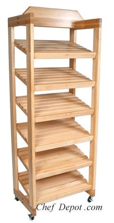 a wooden shelf with four shelves on wheels