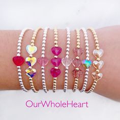 All of our bracelets are handmade in Hoboken, NJ, a little town which is near and dear to our hearts. This beautiful Swarovski heart bracelet is completely customizable - chose a single crystal heart or three. Also choose from 8 colors: red, fuchsia, rose, dusty lilac, mermaid, unicorn, clear, and silk. One inch of extra chain lets you adjust the bracelet to your preference. All items are hand-made in the USA in a smoke-free studio, and most importantly, they're made with OurWholeHeart❤︎ ------- Adjustable Heart Beads Crystal Bracelet Gift, Adjustable Crystal Bracelet With Heart Beads For Gift, Adjustable Heart-shaped Crystal Bracelet Gift, Silver Beaded Crystal Bracelet For Valentine's Day, Valentine's Day Silver Beaded Crystal Bracelet, Valentine's Day Adjustable Bracelets With Faceted Beads, Handmade Adjustable Crystal Bracelet For Valentine's Day, Adjustable Faceted Bead Jewelry For Valentine's Day, Valentine's Day Adjustable Beaded Bracelets With Faceted Beads